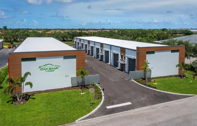 an aerial view of a house with garden space and street view