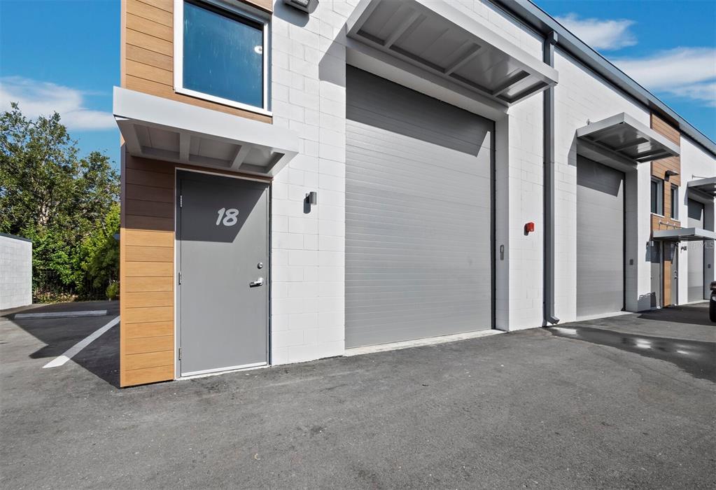 6562 Palmer Park Circle, Unit 18 Sarasota, FL 34238 - Photo 16 of 20 a view of a house with backyard and trees