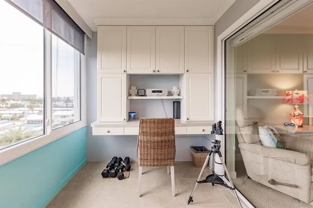 a kitchen with stainless steel appliances kitchen island granite countertop a refrigerator and a sink