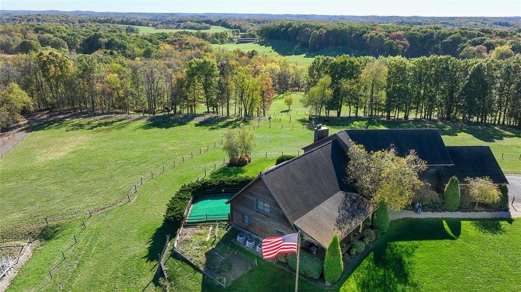 166 McKay Road Saxonburg, PA 16056 - Photo 2 of 48 an aerial view of a house with a garden and lake view