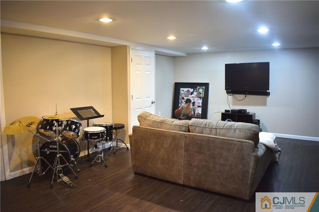 3 Timber Road East Brunswick, NJ 08816 - Photo 13 of 21 a living room with furniture and a flat screen tv