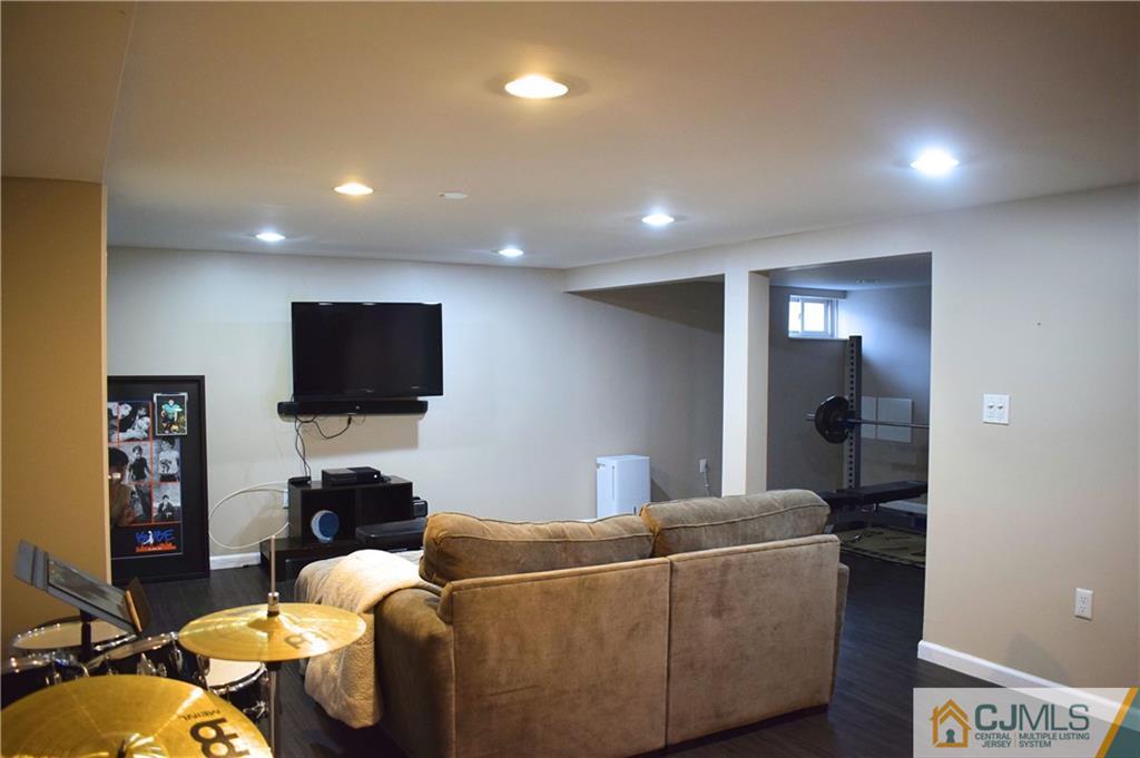 3 Timber Road East Brunswick, NJ 08816 - Photo 14 of 21 a living room with furniture and a flat screen tv