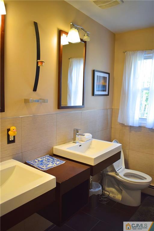 3 Timber Road East Brunswick, NJ 08816 - Photo 15 of 21 a bathroom with a sink a toilet and mirror