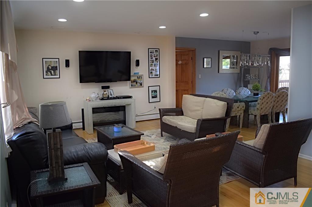 3 Timber Road East Brunswick, NJ 08816 - Photo 3 of 21 a living room with furniture and a flat screen tv