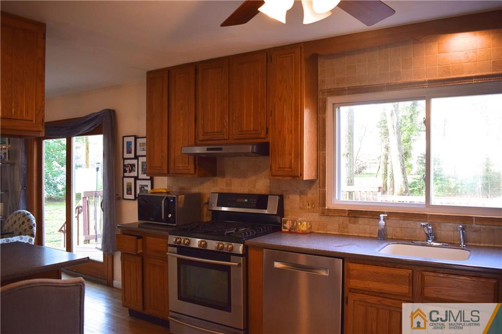 3 Timber Road East Brunswick, NJ 08816 - Photo 7 of 21 a kitchen with stainless steel appliances granite countertop a stove a sink and a microwave