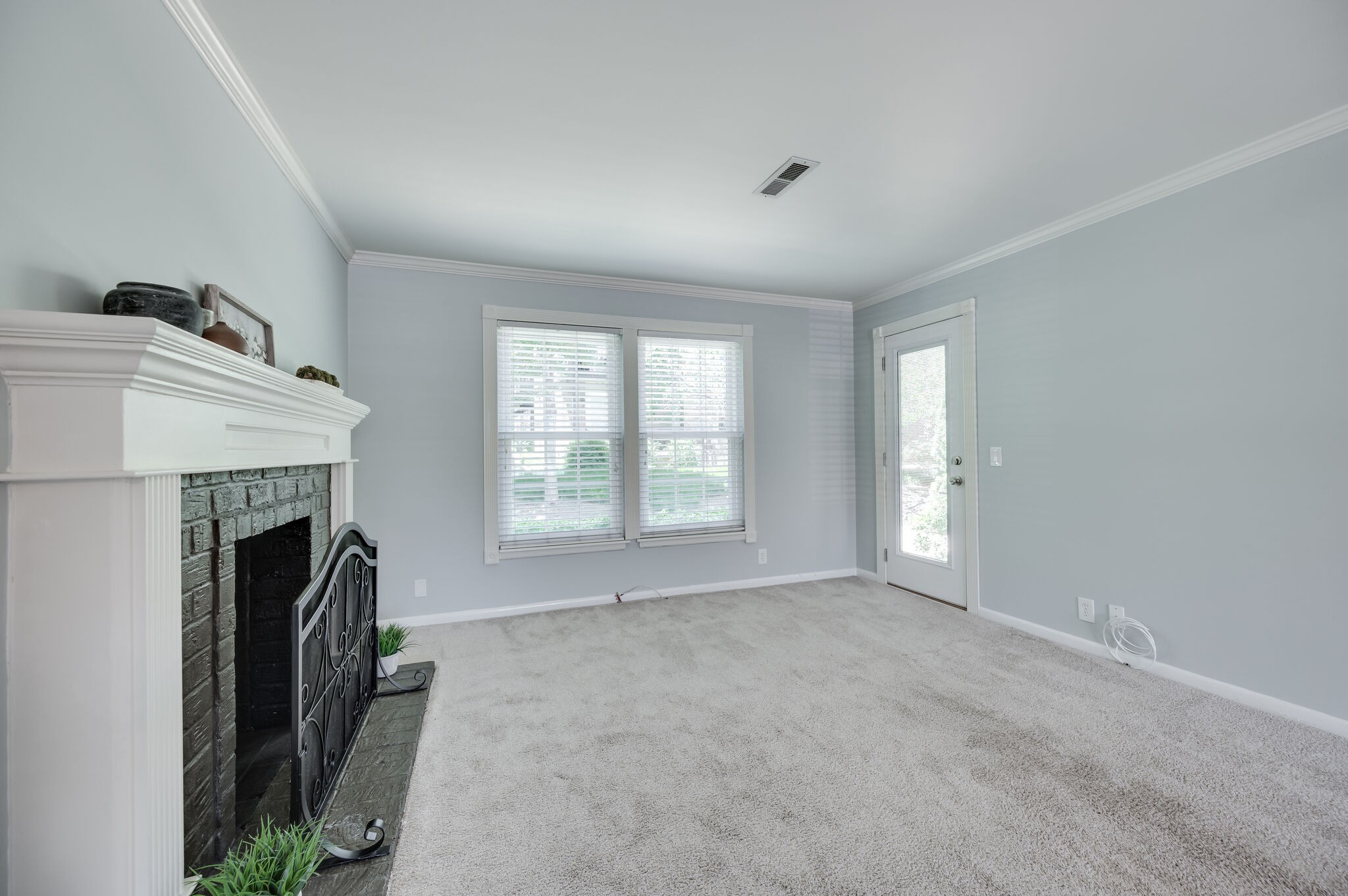 2116 Hobbs Road, Unit M1 Nashville, TN 37215 - Photo 14 of 36 a view of empty room with fireplace and fan