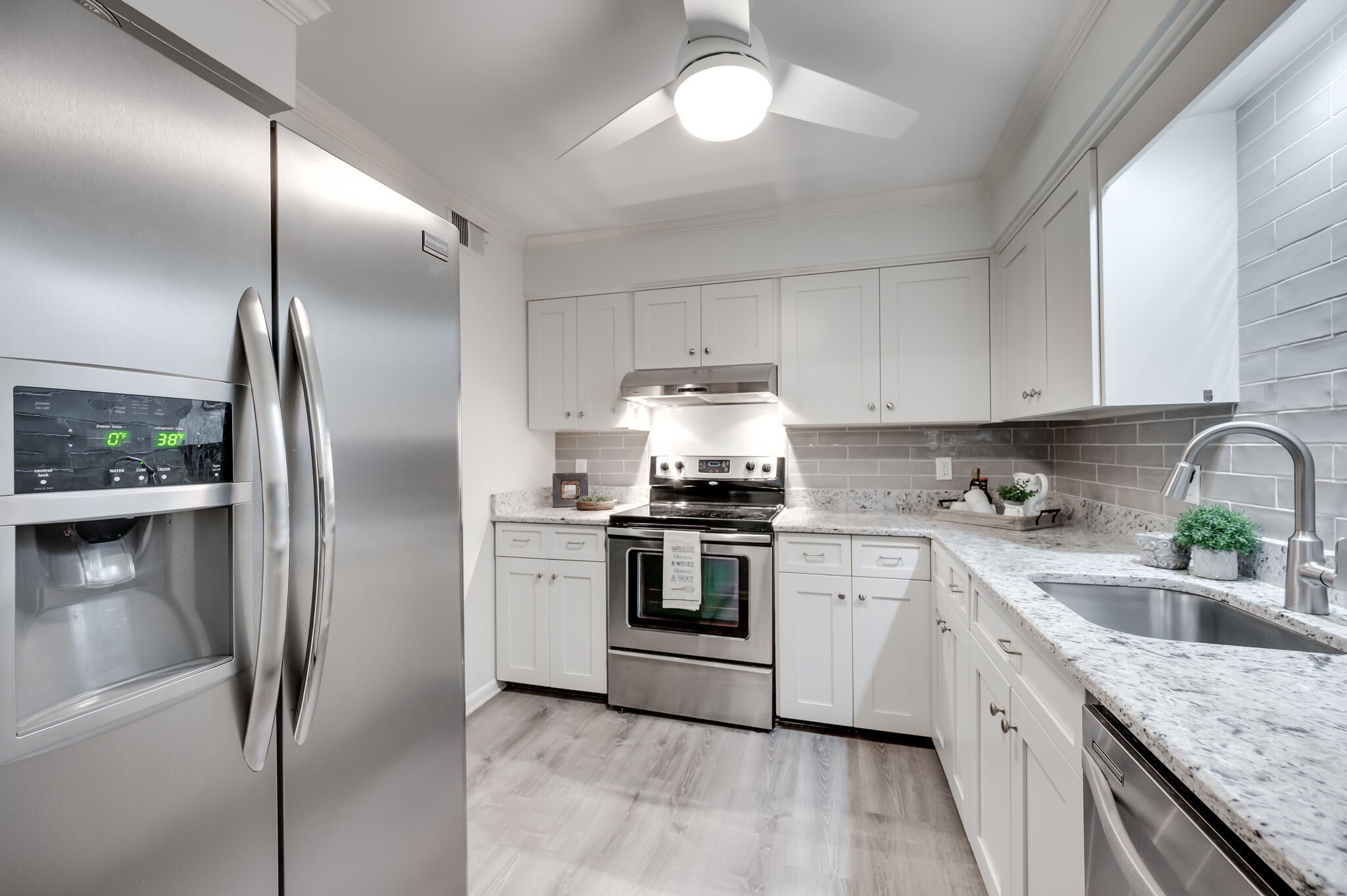 2116 Hobbs Road, Unit M1 Nashville, TN 37215 - Photo 16 of 36 a kitchen with granite countertop stainless steel appliances cabinets a sink and a counter top space