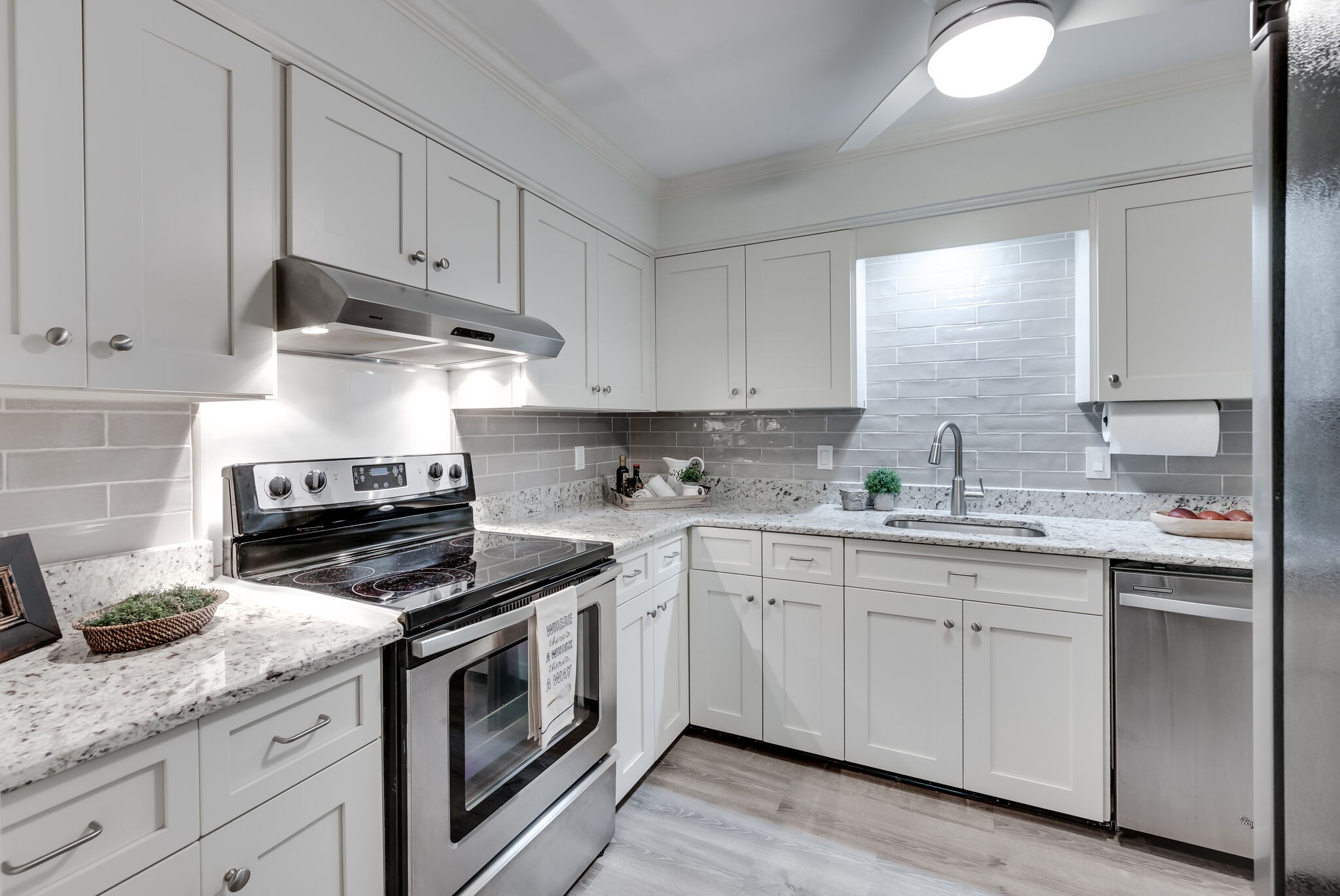 2116 Hobbs Road, Unit M1 Nashville, TN 37215 - Photo 17 of 36 a kitchen with granite countertop white cabinets and white appliances