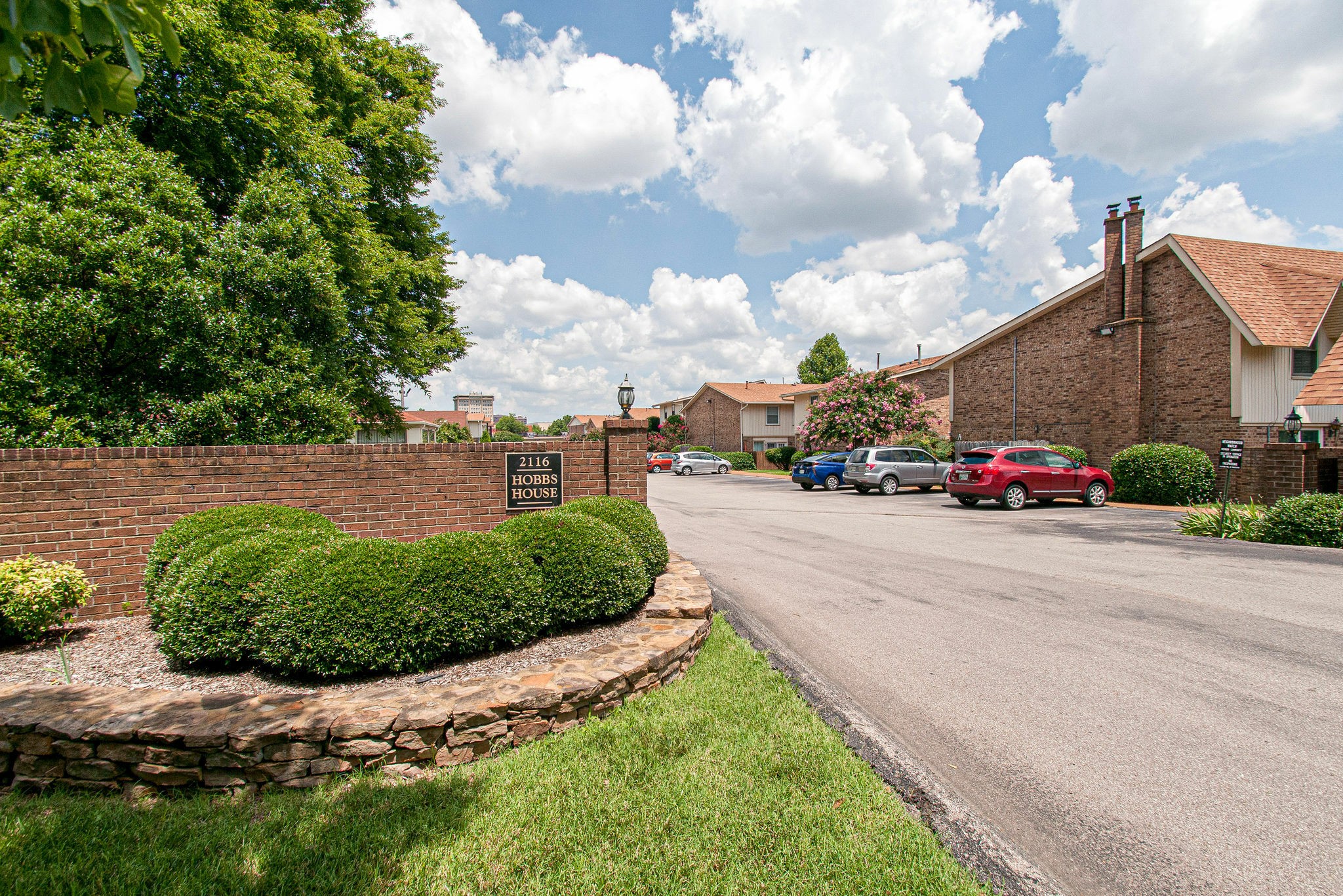 2116 Hobbs Road, Unit M1 Nashville, TN 37215 - Photo 2 of 36 a view of a garden with cars