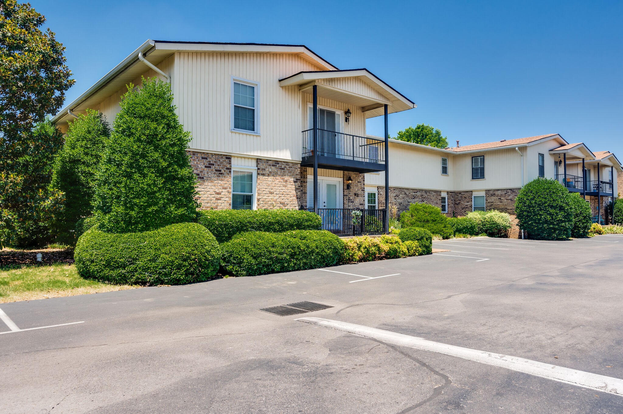 2116 Hobbs Road, Unit M1 Nashville, TN 37215 - Photo 3 of 36 a front view of a house with a yard and garage
