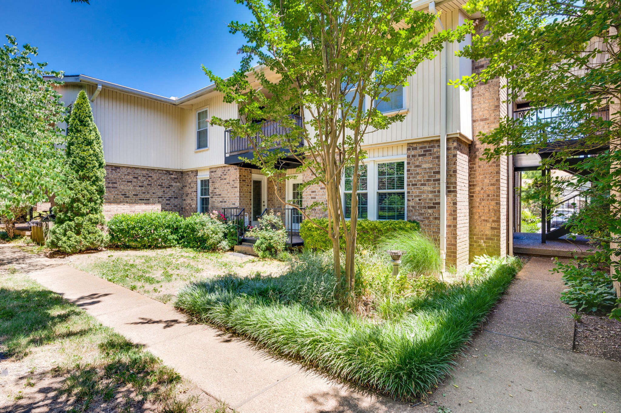 2116 Hobbs Road, Unit M1 Nashville, TN 37215 - Photo 35 of 36 a view of a pathway with a house in the background
