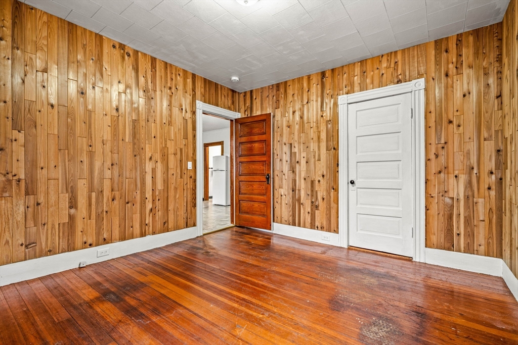 11 Devonshire Street Lawrence, MA 01843 - Photo 18 of 41 a view of a room with wooden floor and door