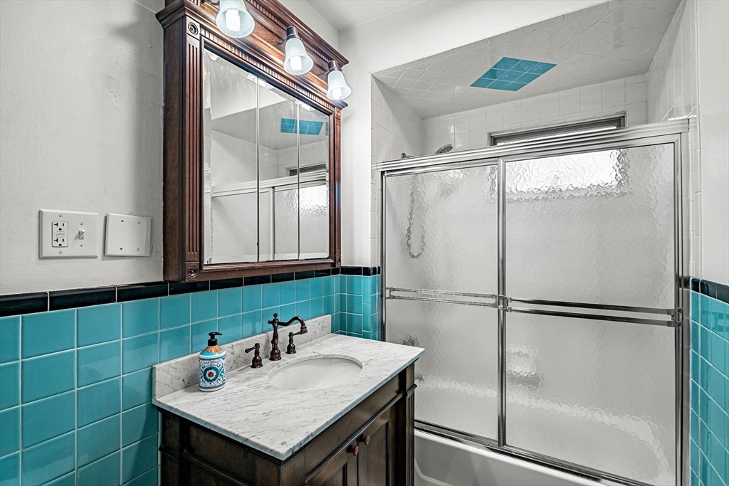 11 Devonshire Street Lawrence, MA 01843 - Photo 21 of 41 a kitchen with a sink a refrigerator and cabinets