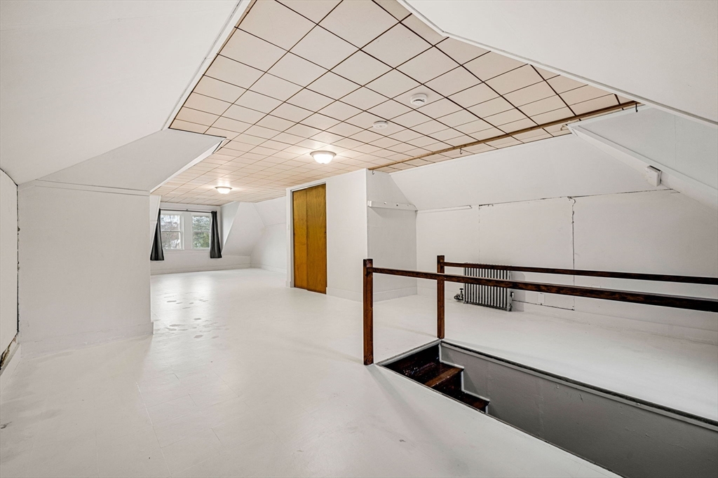 11 Devonshire Street Lawrence, MA 01843 - Photo 24 of 41 a hallway with sliding door and wooden floor