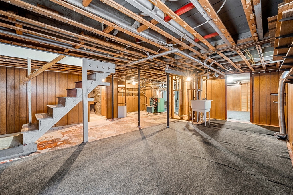 11 Devonshire Street Lawrence, MA 01843 - Photo 25 of 41 a view of a room with wooden floor and stairs