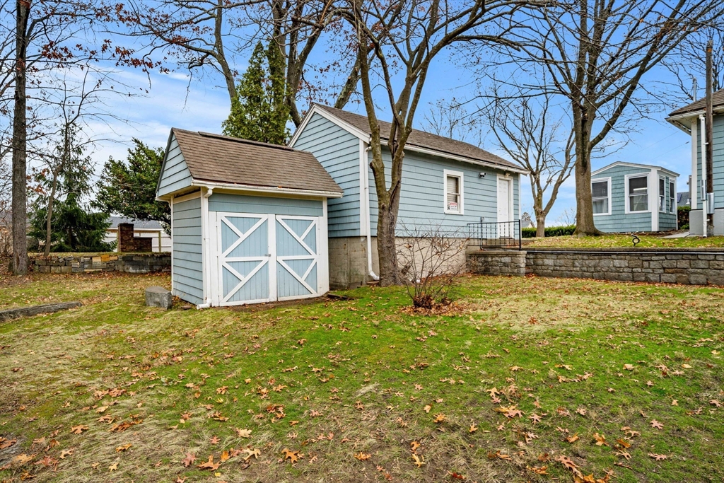 11 Devonshire Street Lawrence, MA 01843 - Photo 30 of 41 a white house that has a tree in front of it