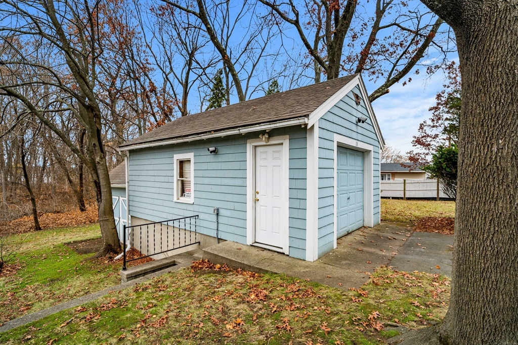 11 Devonshire Street Lawrence, MA 01843 - Photo 31 of 41 a view of a house with a yard and large tree