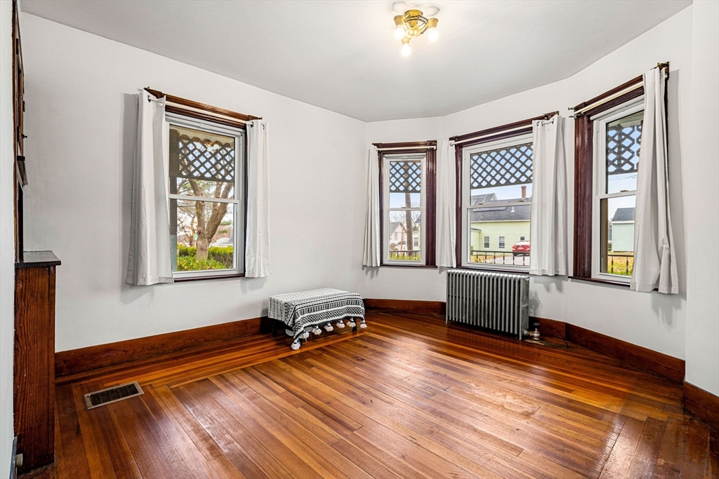 11 Devonshire Street Lawrence, MA 01843 - Photo 10 of 41 a living room with hardwood floor and a window