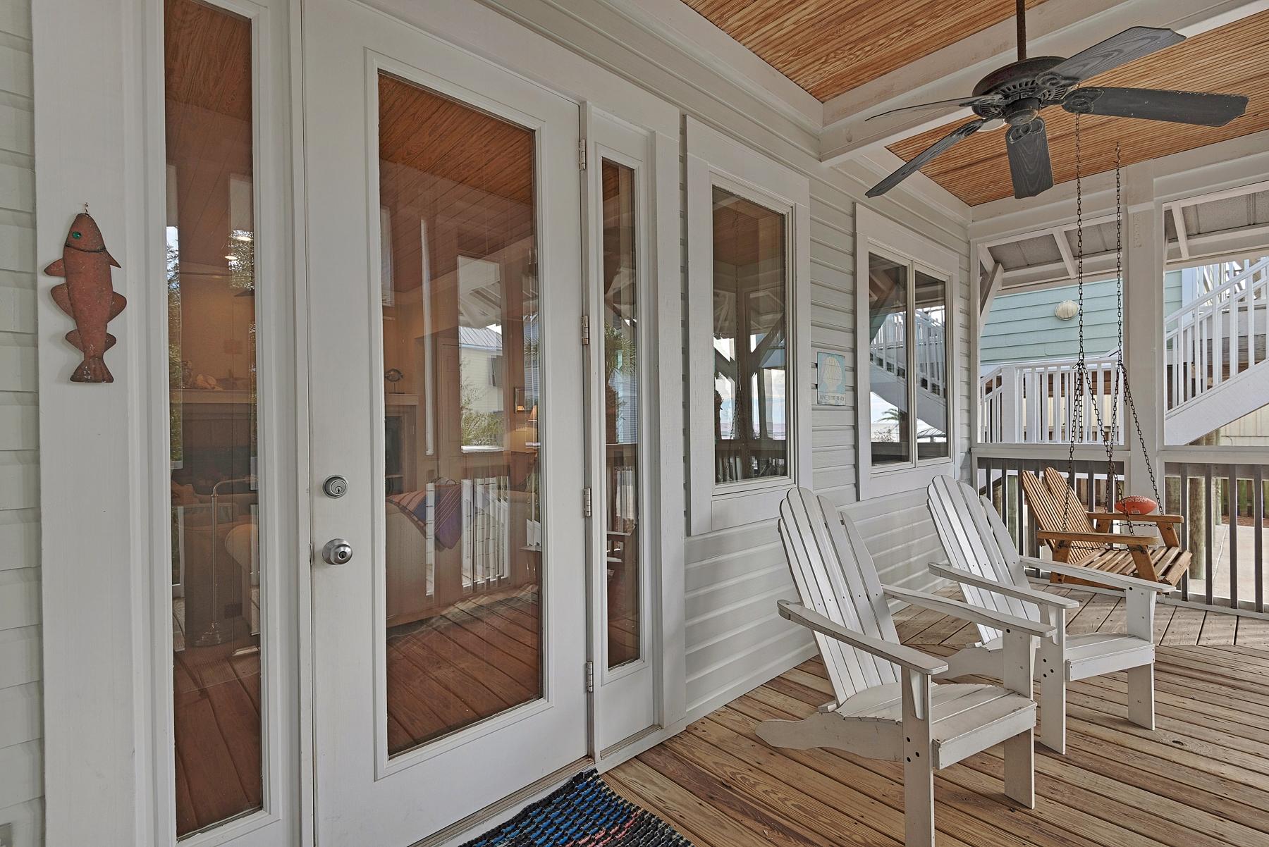 139 Banfill Road Santa Rosa Beach, FL 32459 - Photo 11 of 46 a view of a hallway with wooden floor and windows