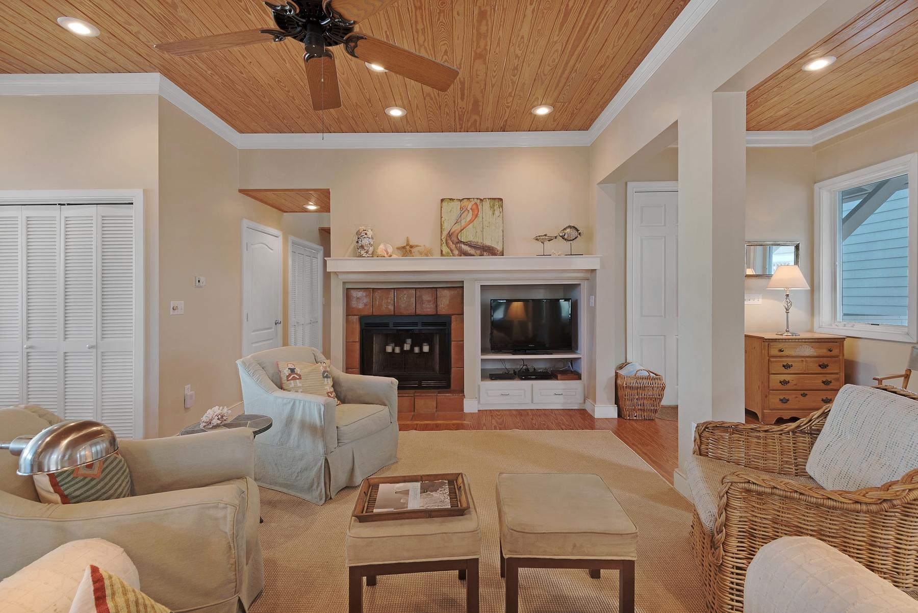 139 Banfill Road Santa Rosa Beach, FL 32459 - Photo 13 of 46 a living room with furniture a fireplace and a chandelier