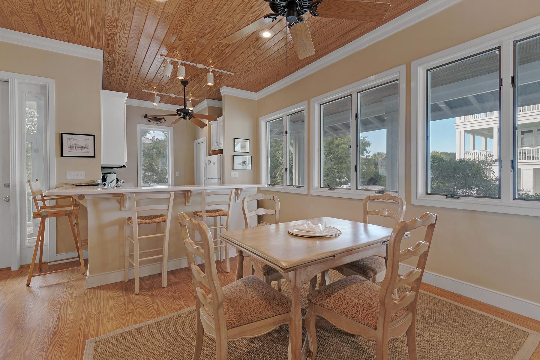 139 Banfill Road Santa Rosa Beach, FL 32459 - Photo 17 of 46 a view of a dining room with furniture and window