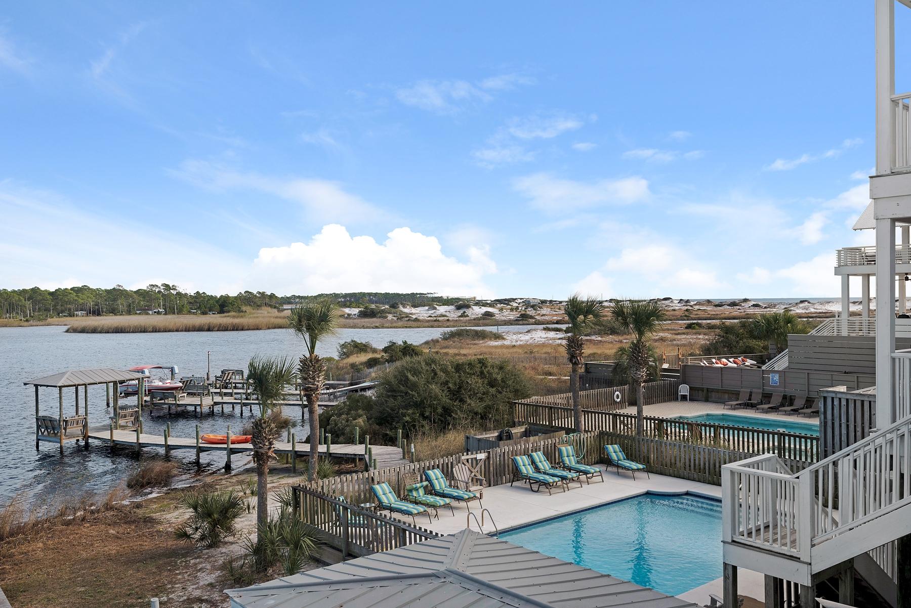 139 Banfill Road Santa Rosa Beach, FL 32459 - Photo 3 of 46 a view of a lake with couches and city view
