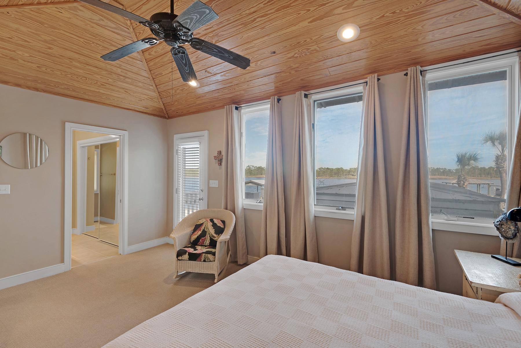 139 Banfill Road Santa Rosa Beach, FL 32459 - Photo 23 of 46 a bedroom with furniture and a large window