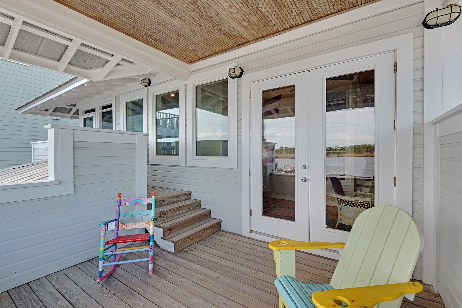 139 Banfill Road Santa Rosa Beach, FL 32459 - Photo 29 of 46 a backyard of a house with wooden floor and furniture