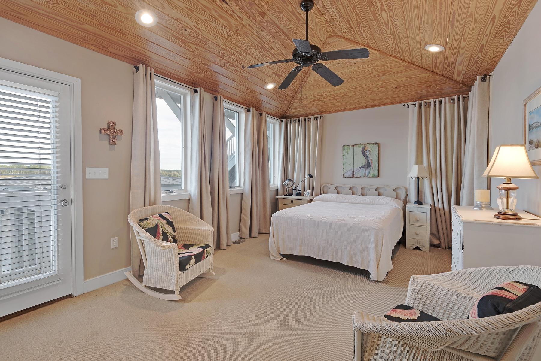 139 Banfill Road Santa Rosa Beach, FL 32459 - Photo 4 of 46 a spacious bedroom with a bed a couch and furniture