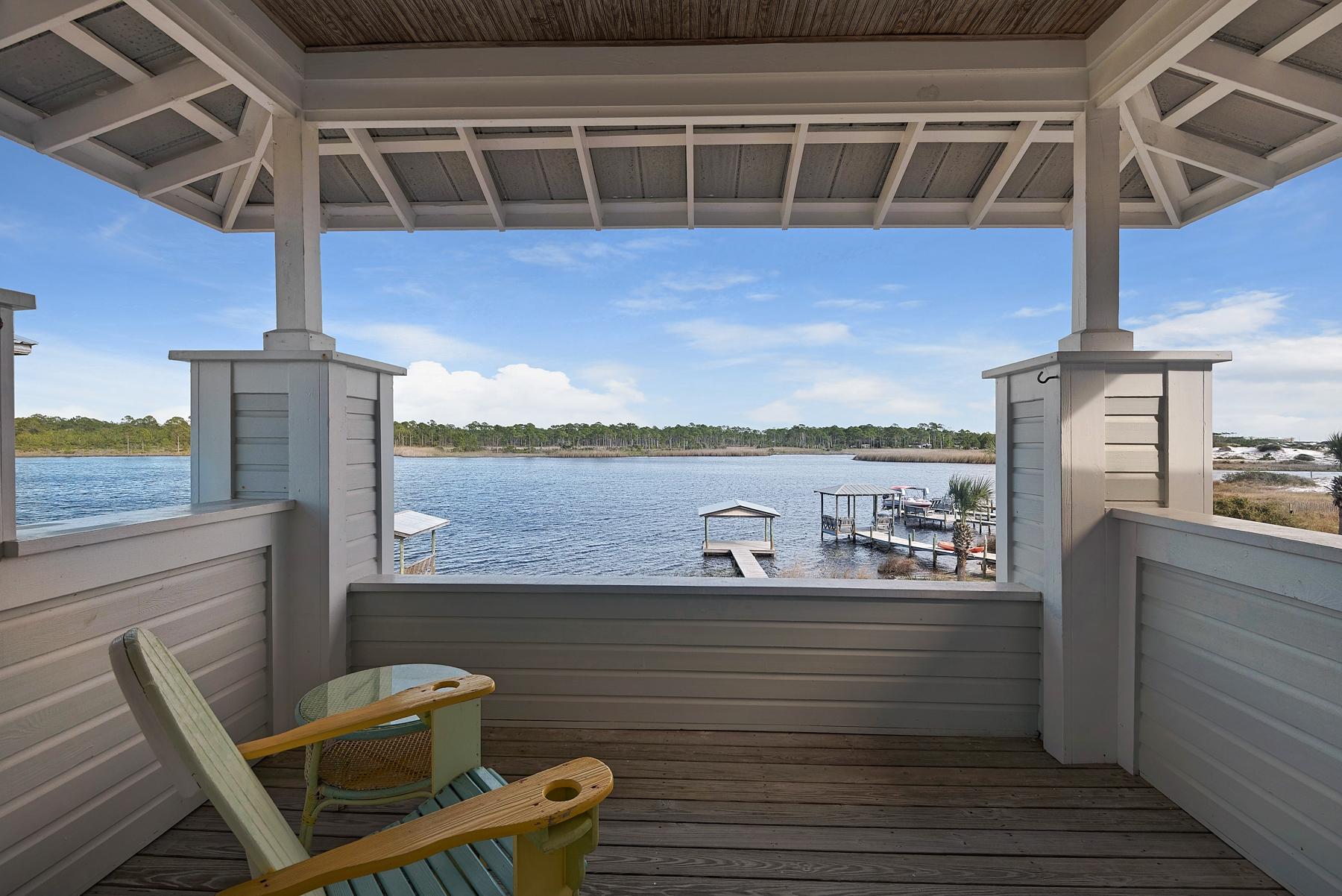 139 Banfill Road Santa Rosa Beach, FL 32459 - Photo 7 of 46 a view of a balcony with chair and wooden floor