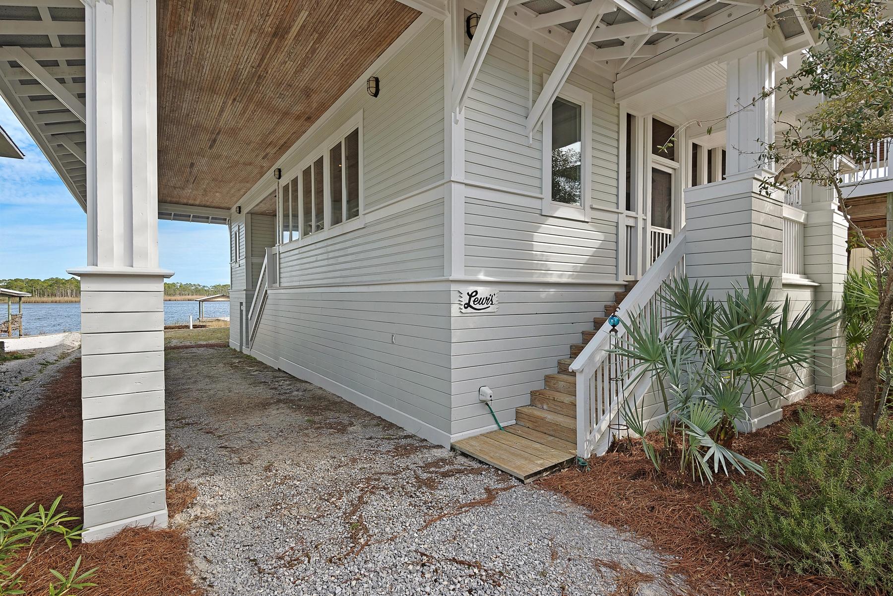 139 Banfill Road Santa Rosa Beach, FL 32459 - Photo 8 of 46 a view of a house with a yard