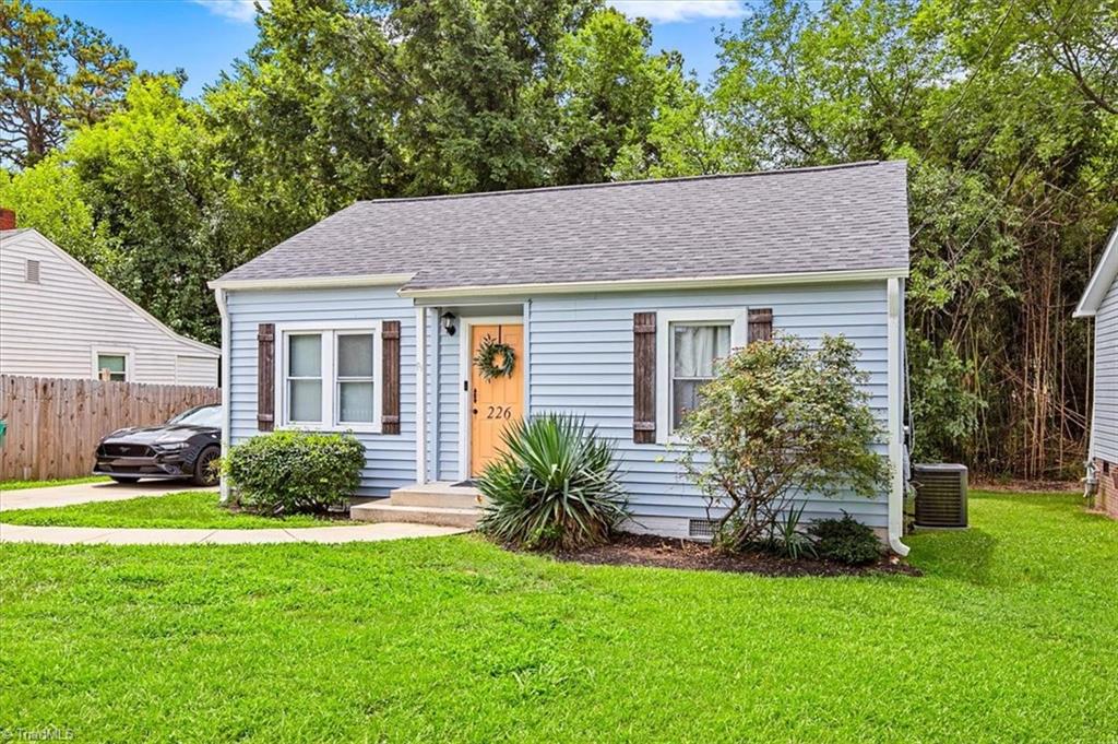 226 Friendly Avenue High Point, NC 27260 - Photo 1 of 38 226 Friendly Avenue is a 1953 bungalow in the Milbourne Heights neighborhood of High Point, NC, offering light blue siding, an orange front door, and classic curb appeal on a 0.18 acre lot.