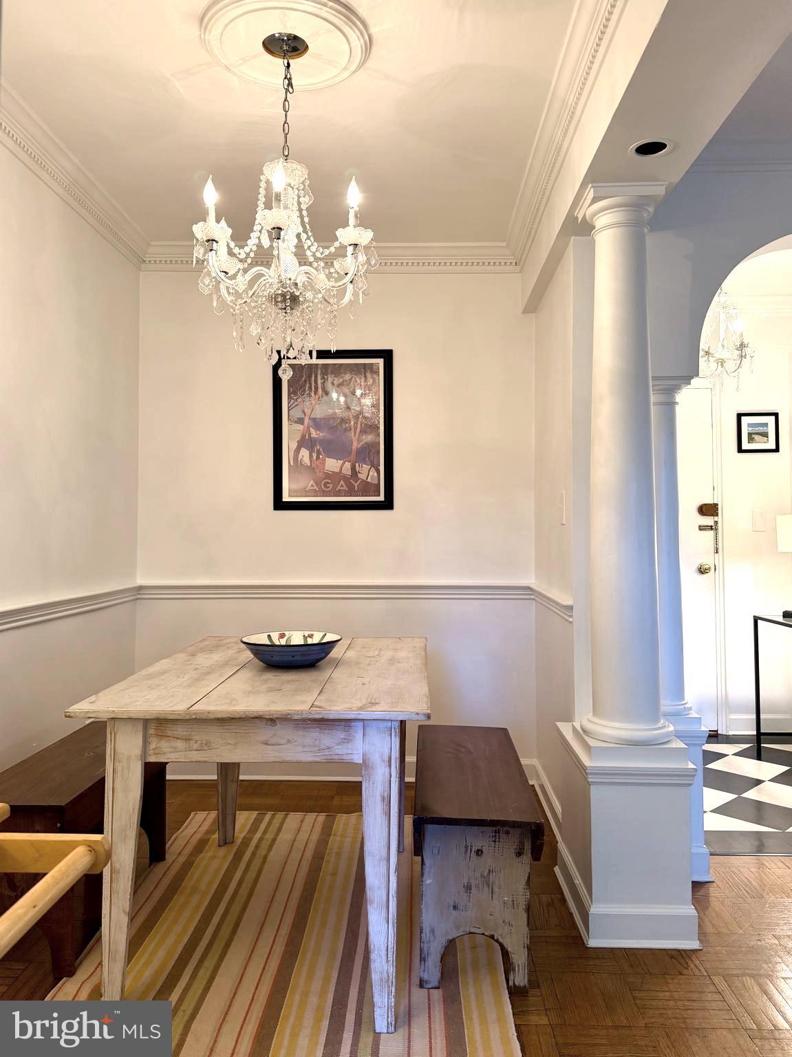 2500 Q Street Northwest, Unit 307 Washington, DC 20007 - Photo 14 of 17 a view of a dining room with furniture and chandelier
