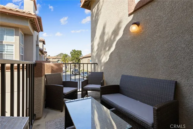 a view of a balcony with chairs