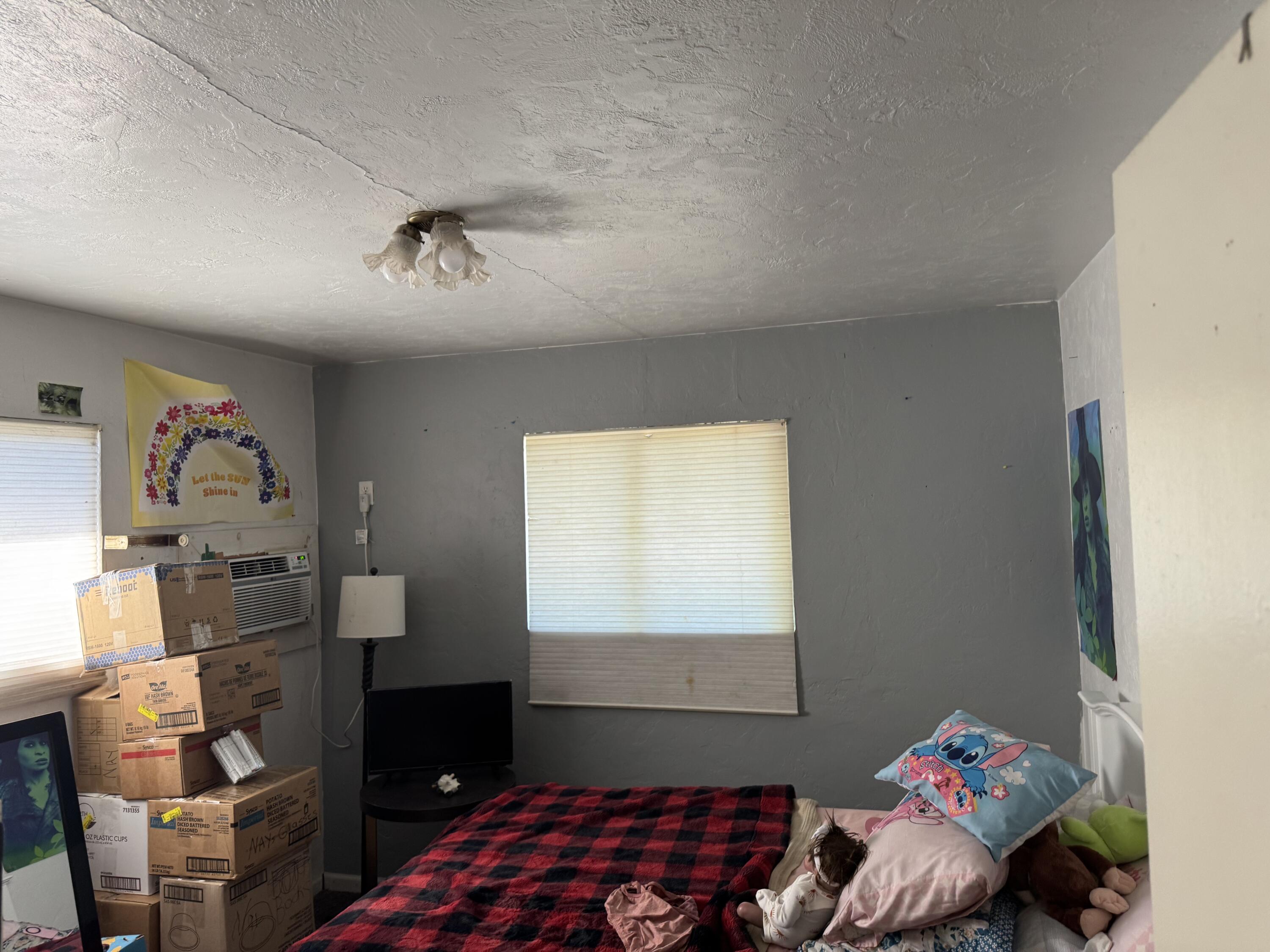 1015 Gold Street Redding, CA 96001 - Photo 11 of 17 a bedroom with a bed and a window