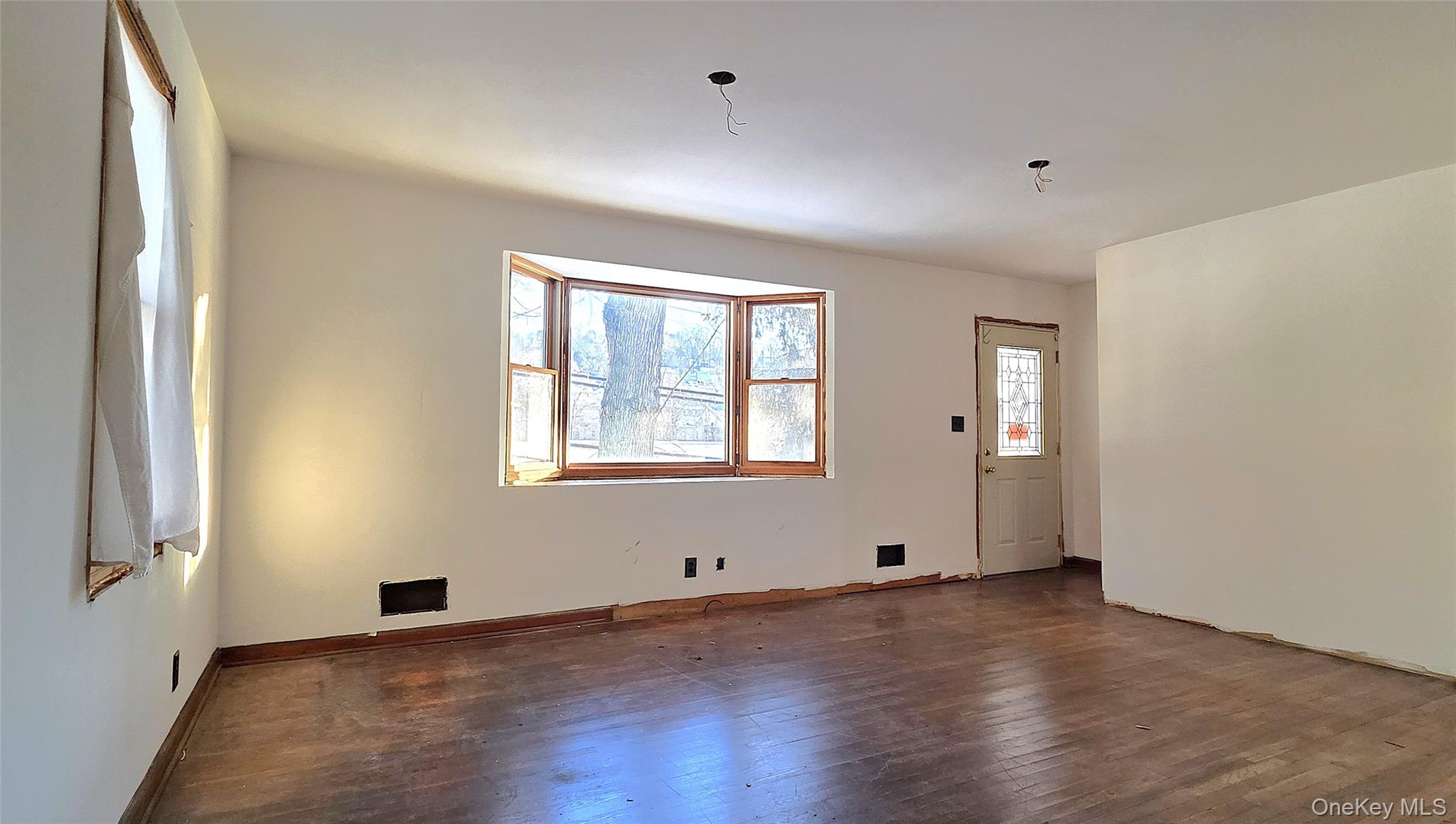 1716 A Main Street Peekskill, NY 10566 - Photo 4 of 13 a view of empty room with wooden floor and fan