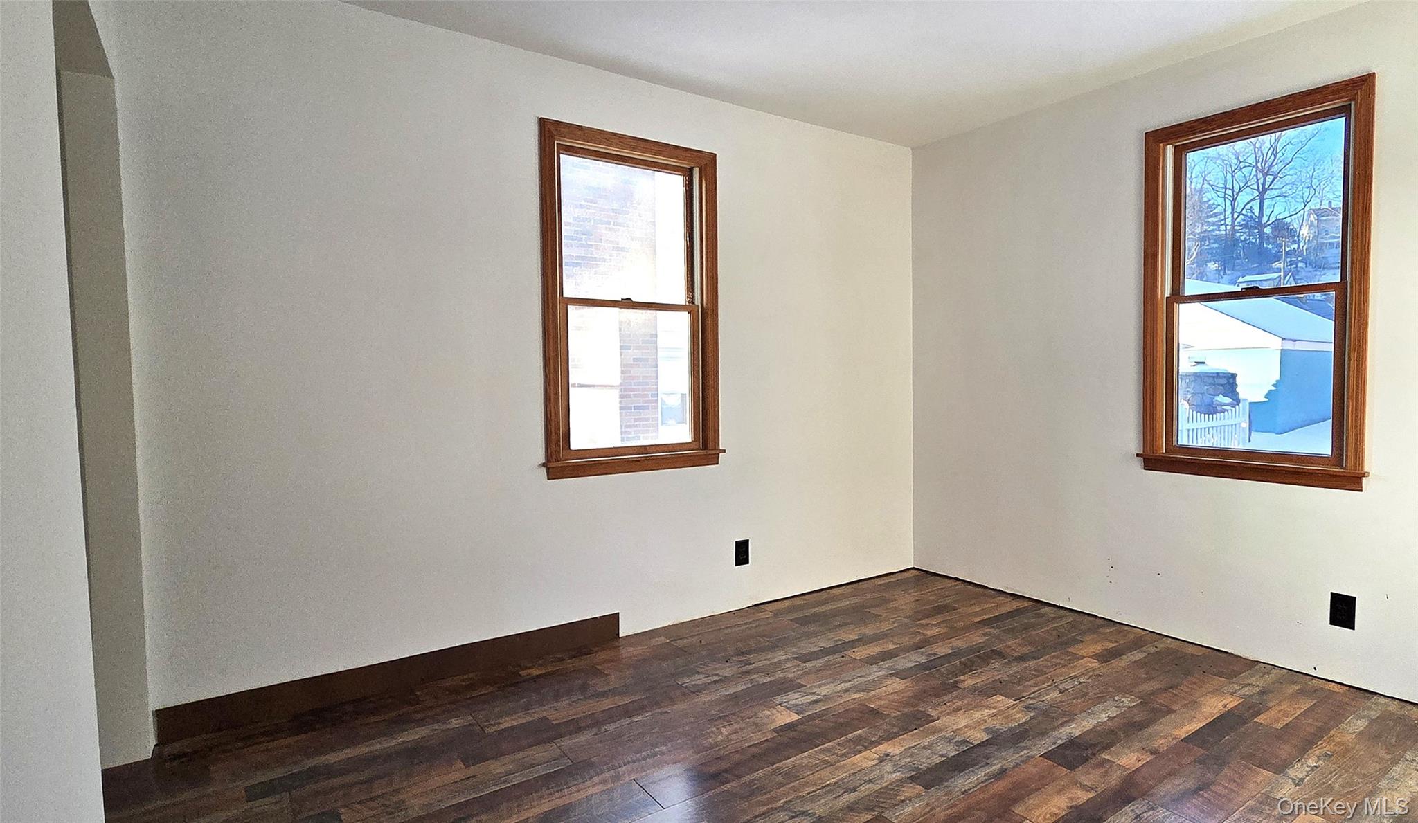 1716 A Main Street Peekskill, NY 10566 - Photo 8 of 13 a view of an empty room with wooden floor and a window