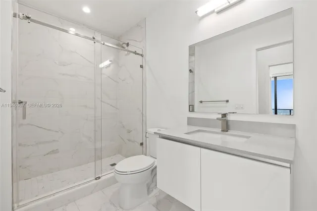 a kitchen with a table and chairs in it