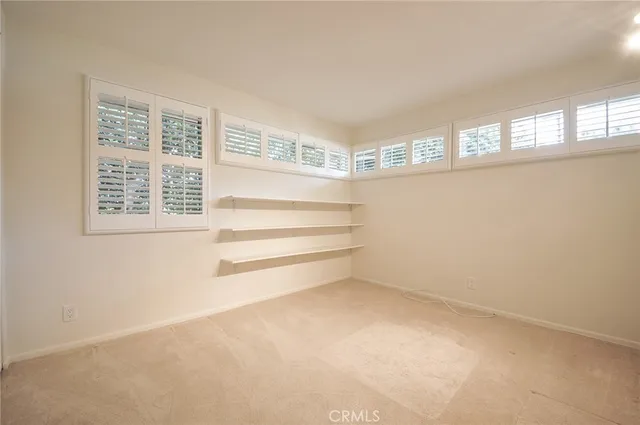 a view of empty room with windows