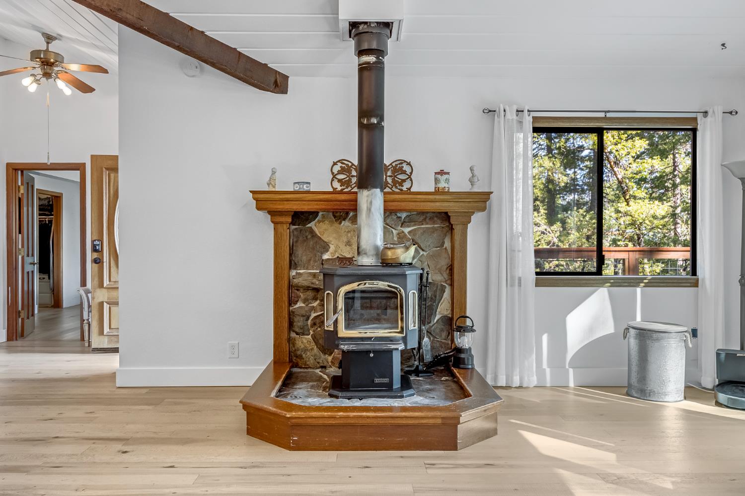 12081 Robust Way Nevada City, CA 95959 - Photo 12 of 39 a living room with fireplace furniture and a large window