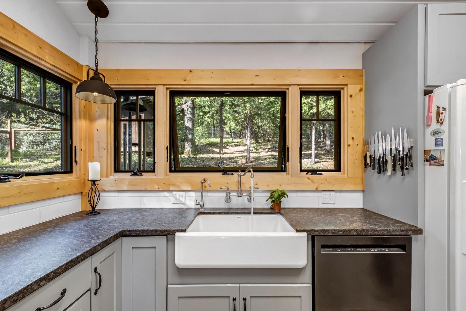12081 Robust Way Nevada City, CA 95959 - Photo 18 of 39 a kitchen with a sink and a large window