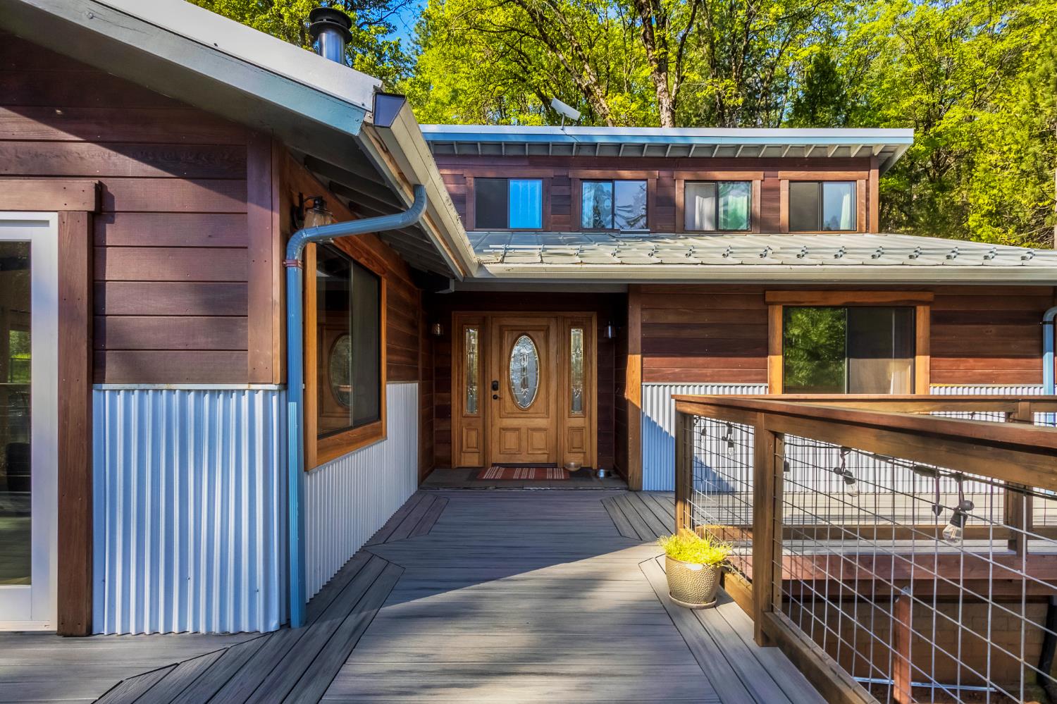12081 Robust Way Nevada City, CA 95959 - Photo 2 of 39 a front view of a house with a porch and a furniture