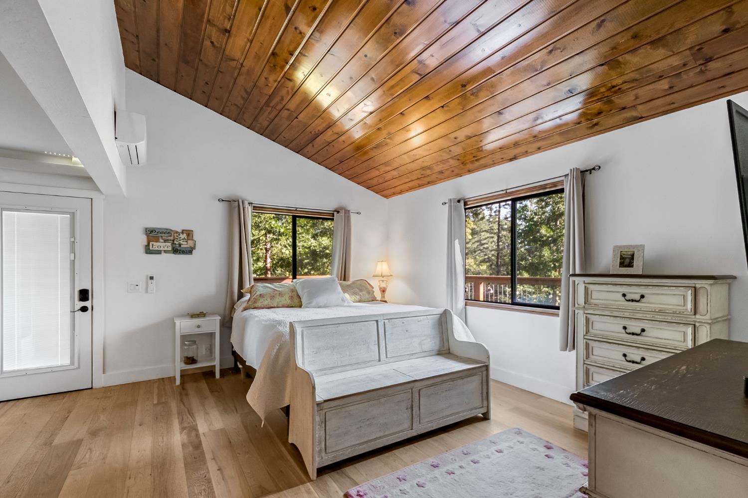 12081 Robust Way Nevada City, CA 95959 - Photo 23 of 39 a spacious bedroom with a bed and a window