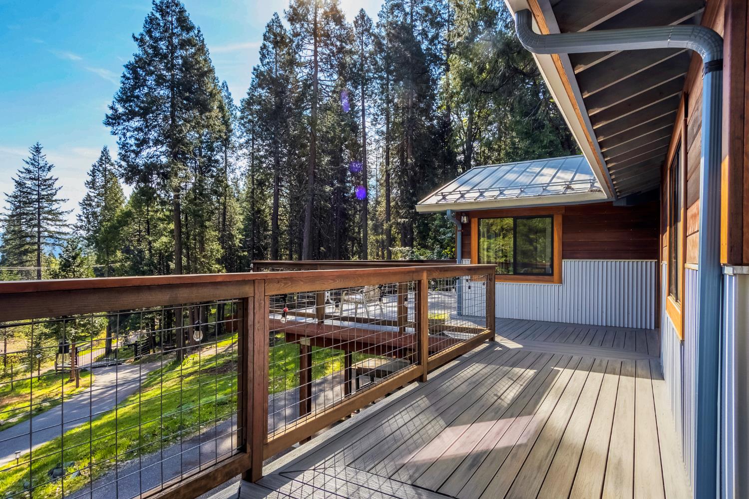12081 Robust Way Nevada City, CA 95959 - Photo 28 of 39 a view of a wooden deck with chairs and a yard