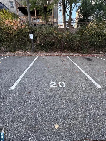 a view of a house with a yard and tree s
