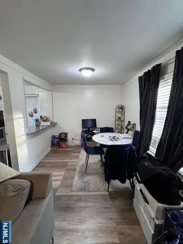 a living room with furniture and a mirror