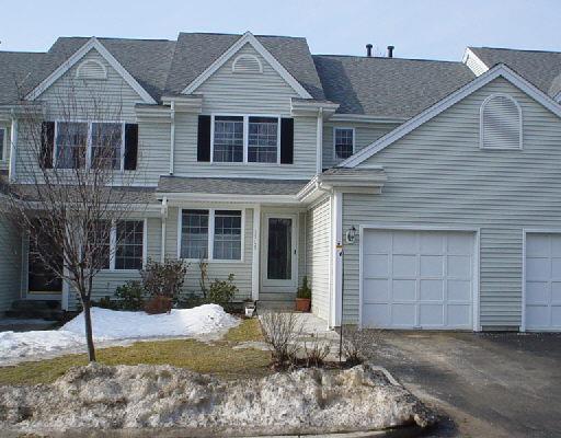 1705 Revere Road, Unit 1705 Danbury, CT 06811 - Photo 1 of 1 a front view of a house with garden