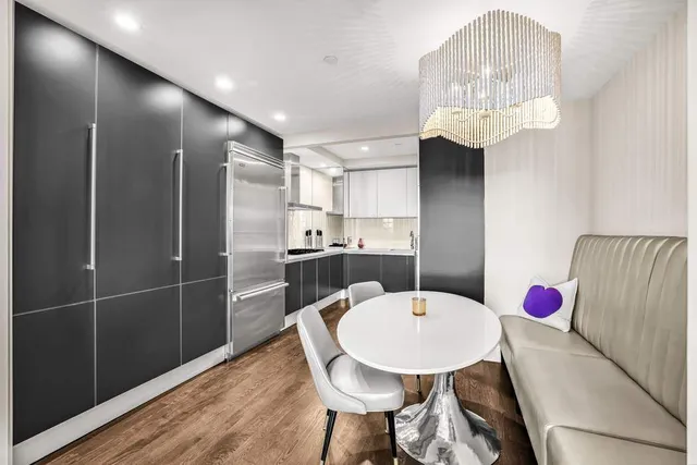 a living room with furniture wooden floor and a fireplace
