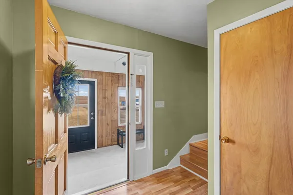 a bathroom with a glass shower door and a bathtub