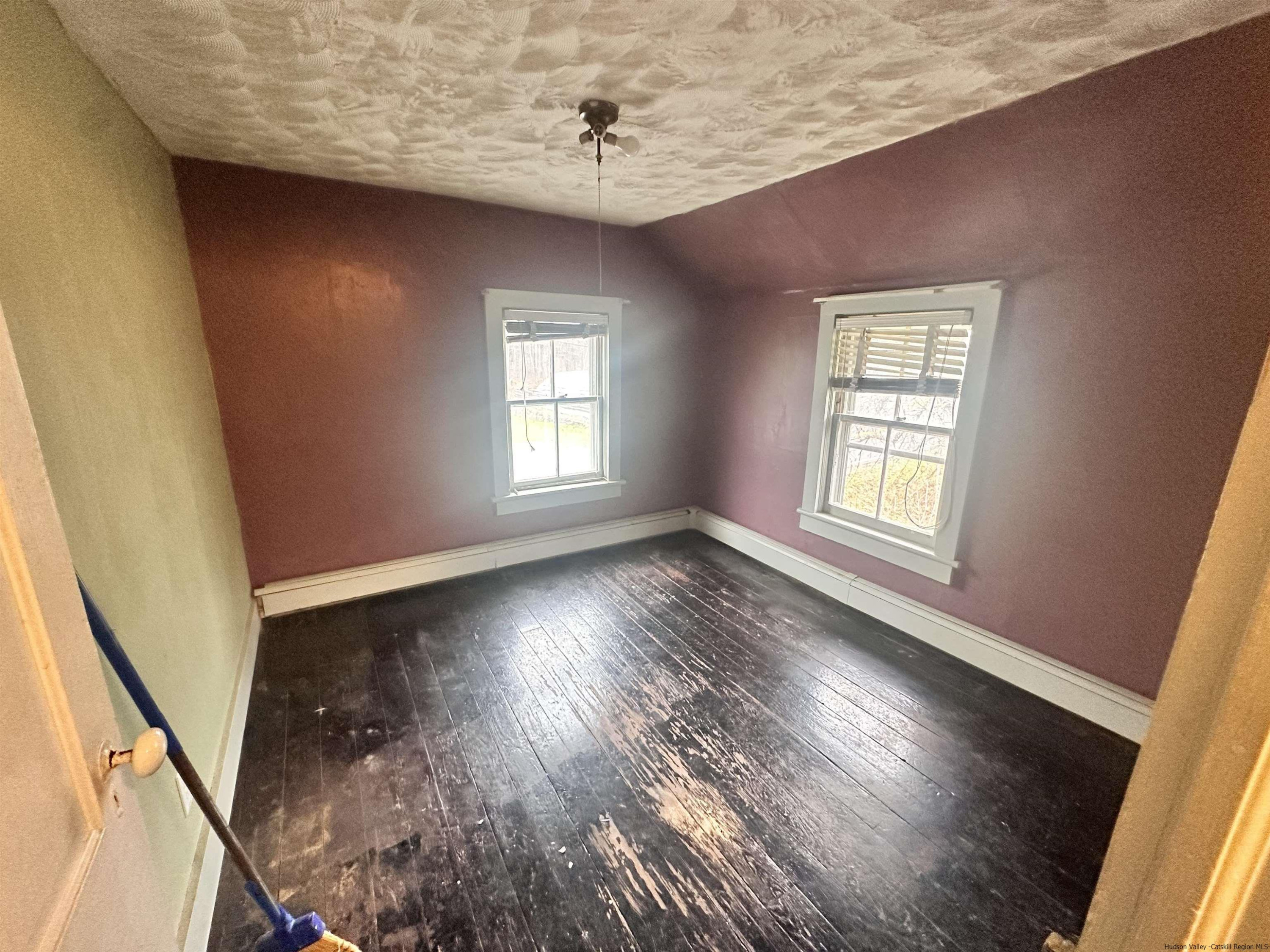 258 North Lake Road Haines Falls, NY 12436 - Photo 9 of 12 a view of an empty room with wooden floor and a window